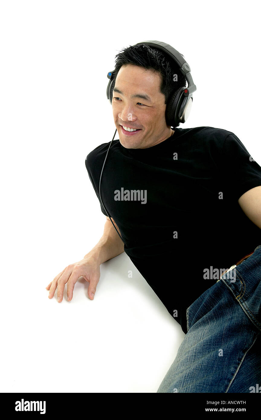 Man Listening to Headphones Stock Photo - Alamy