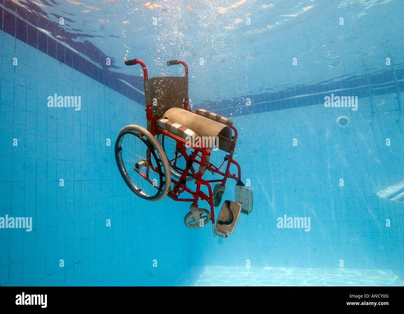 a dissabled lady finally gets her freedom in a swimming pool