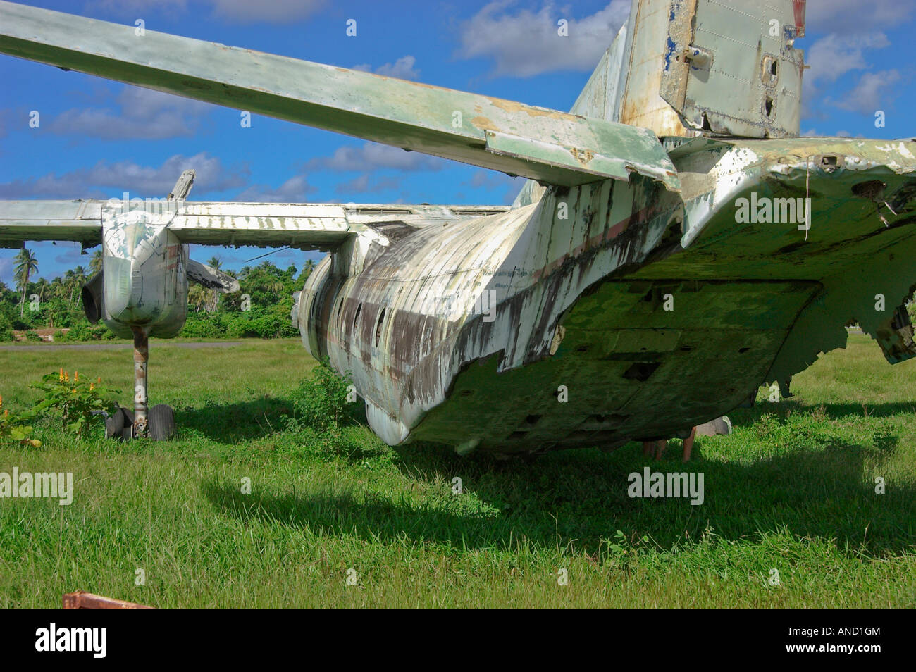 An abandoned aeroplane sits rusting in an empty field, relic of the coup in October 1983 Stock Photo