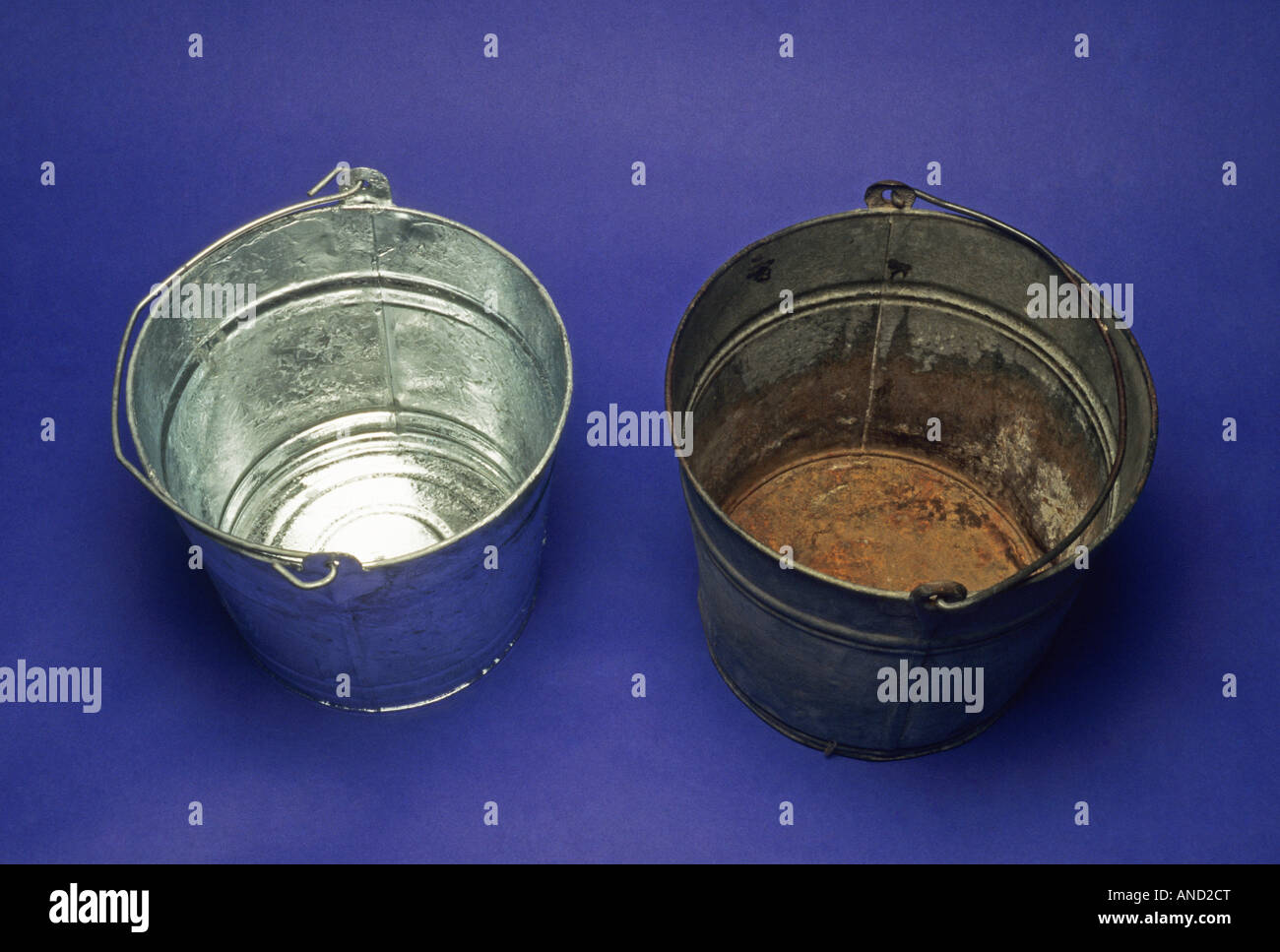 Chemical reactions galvanized steel bucket shows no rust non galvanized steel showing rust science chemistry physics reactions Stock Photo