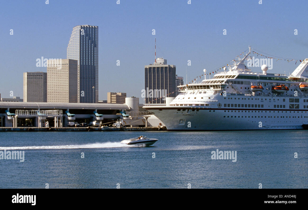A speed boat near a large cruise liner at the Port of Miami Stock Photo