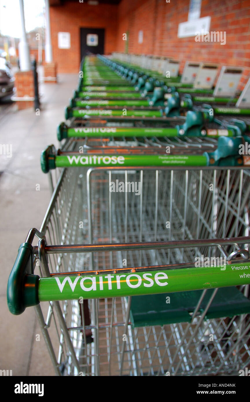 Shopping trollies outside a Waitrose supermarket, UK Stock Photo