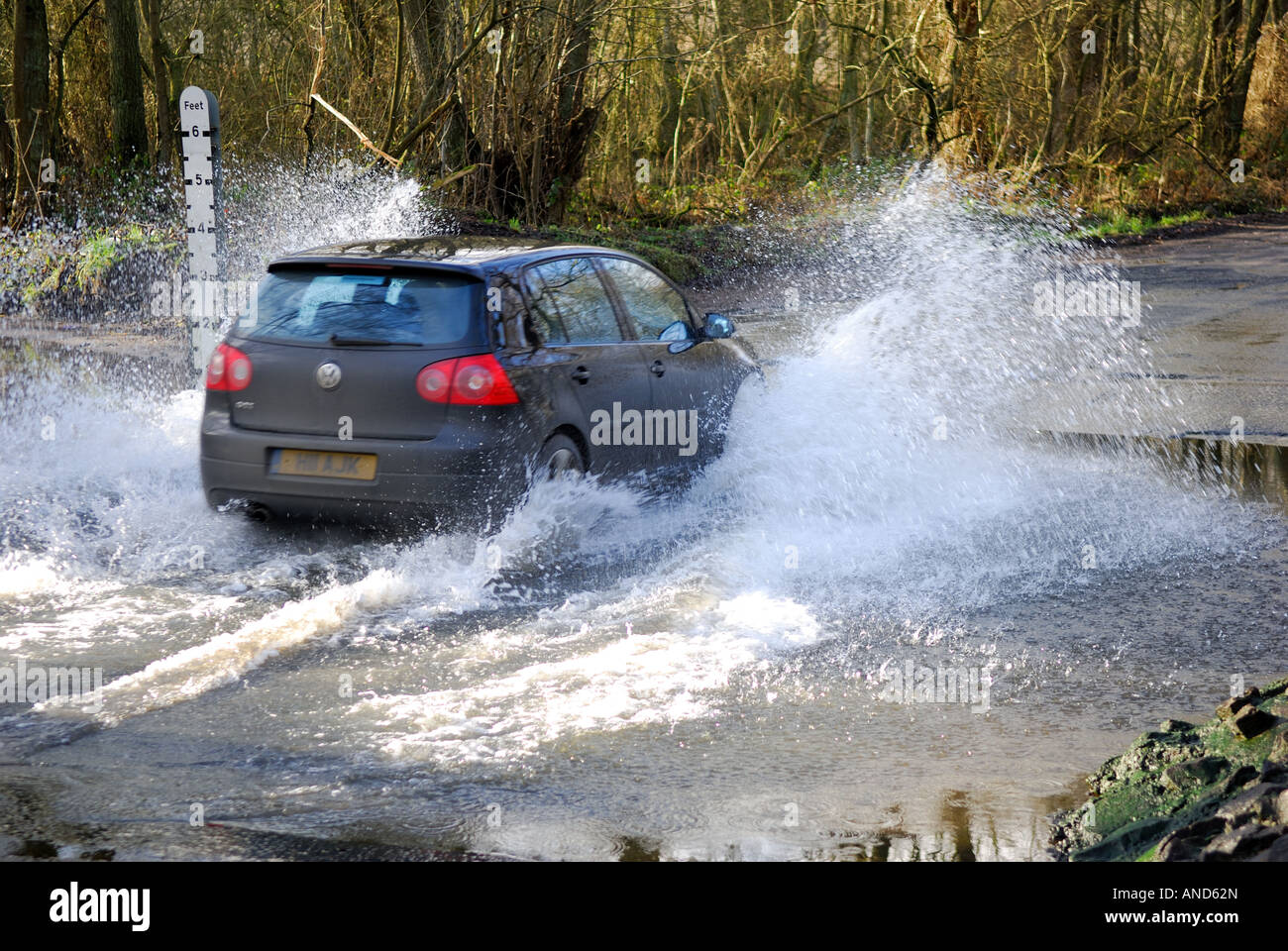 Vw car passing through water ford. Stock Photo