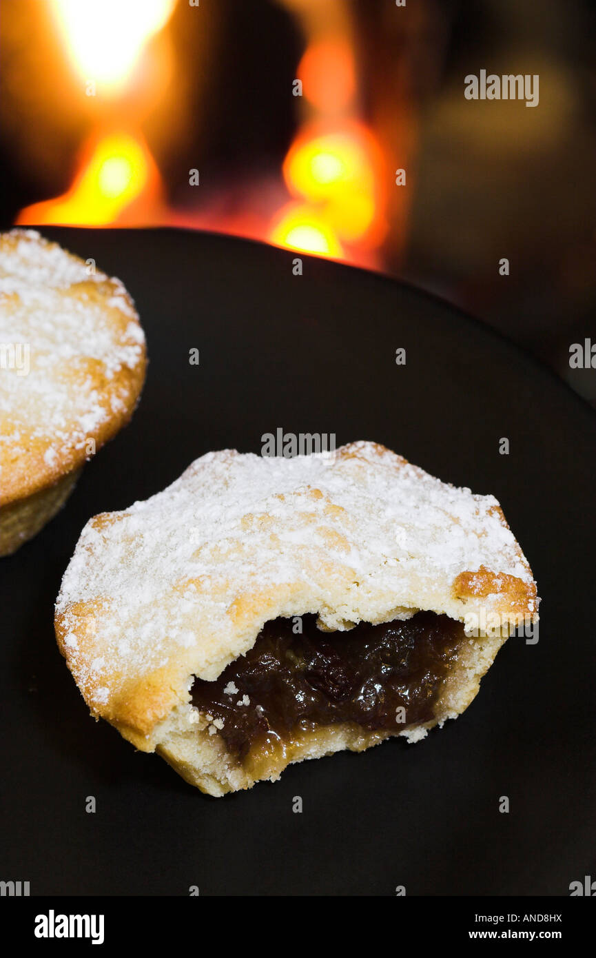 Mince pies on plate in front of fire Stock Photo - Alamy