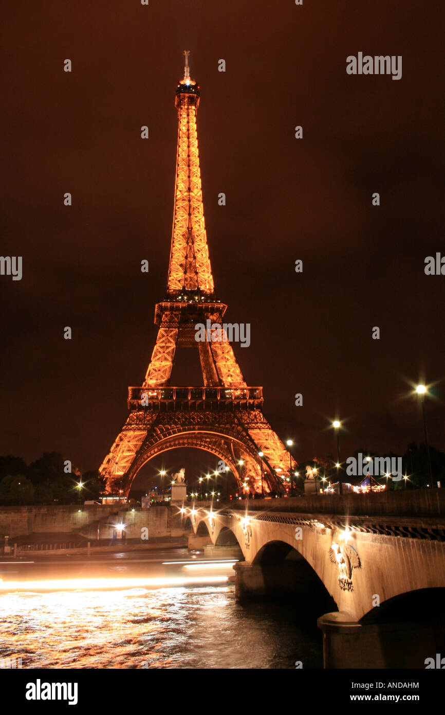 Eiffel Tower with the lights from the boats cruising up the Seine River, Paris France Stock Photo