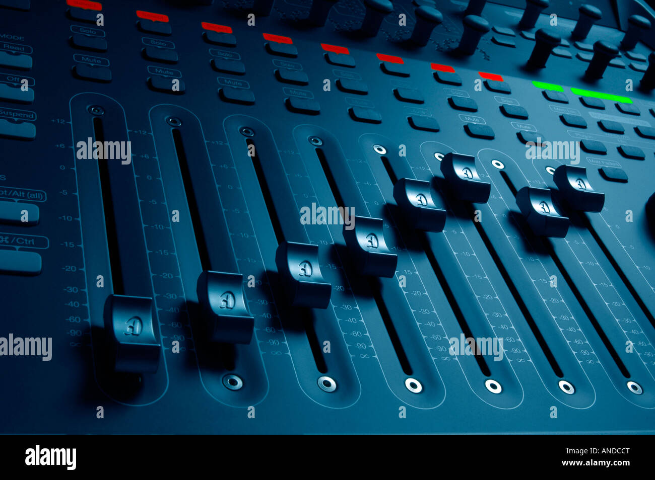 Audio mixing mixer board sliders from a professional music and sound studio for audio engineering Stock Photo