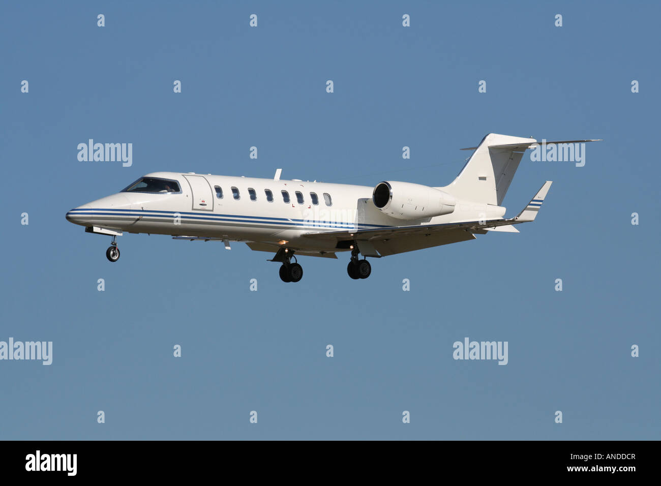 Business jet aircraft on arrival. Private aviation. Proprietary markings deleted. Stock Photo
