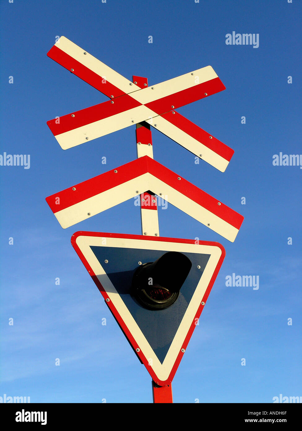 Railway crossing sign post Stock Photo