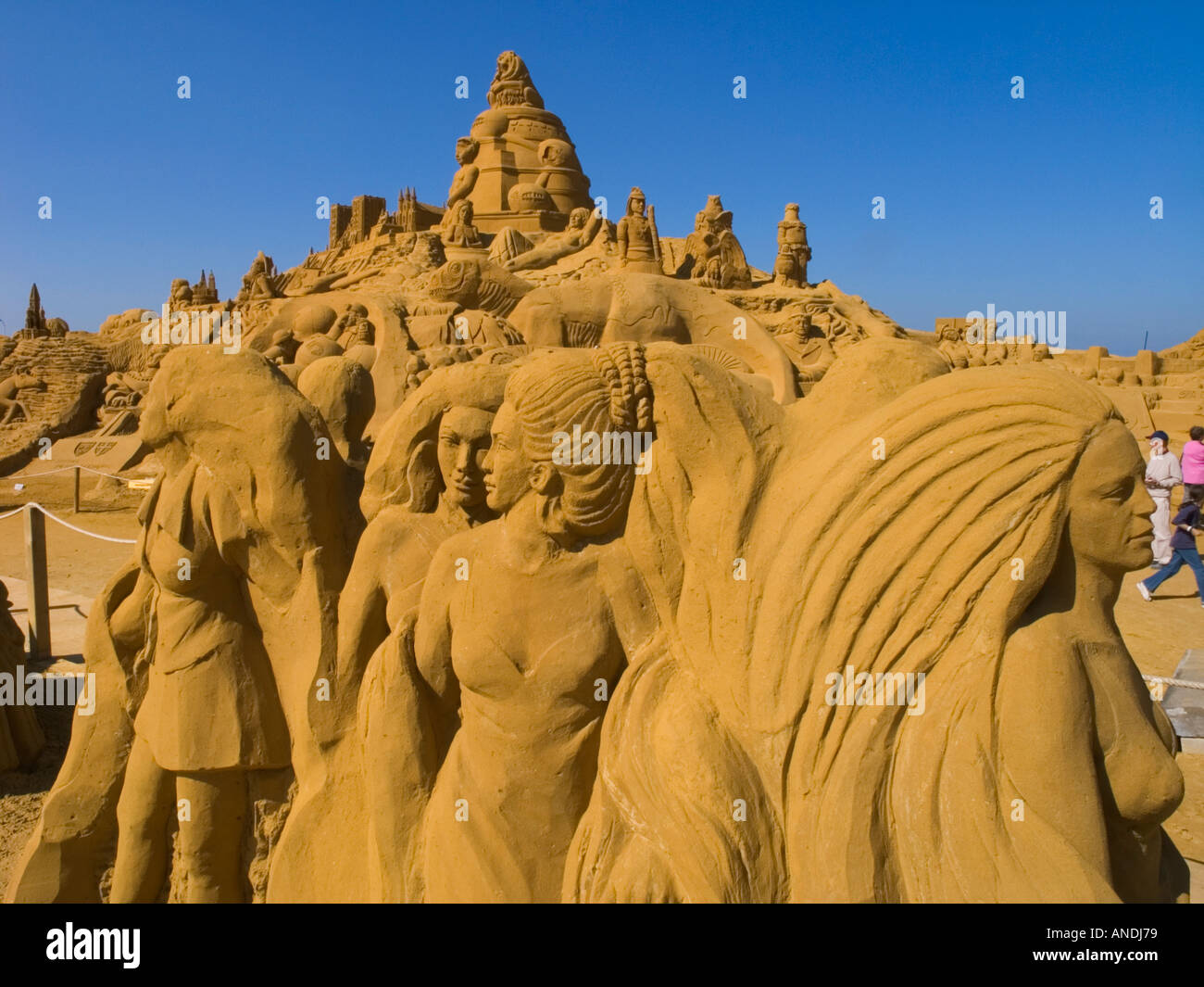 A sand sculpture of a woman's face