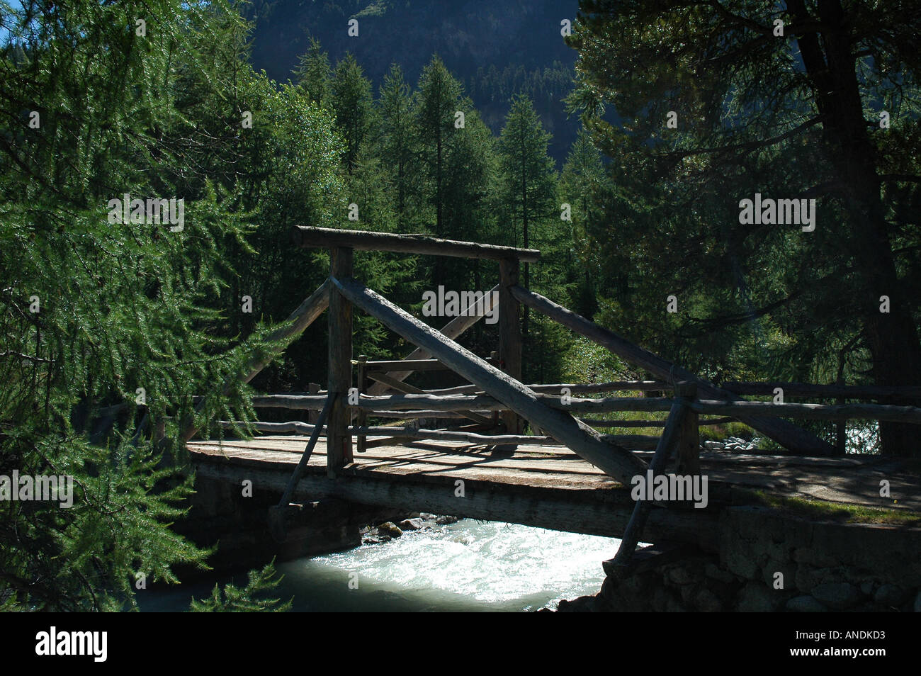 Old wooden bridge over river Stock Photo