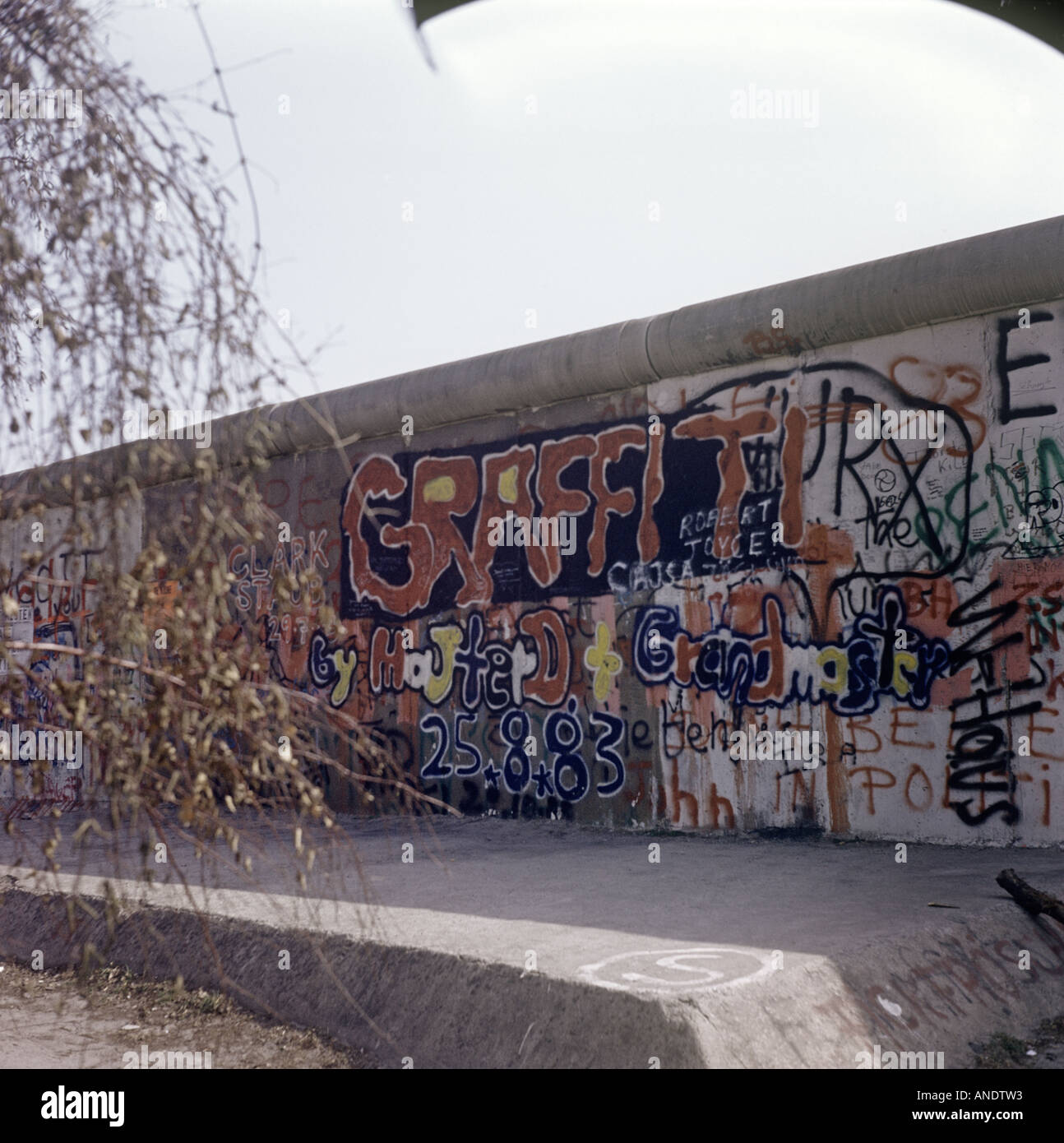 The Berlin Wall, built by Communist East Germany in 1961, and covered in graffiti, was pulled down late 1990. Stock Photo
