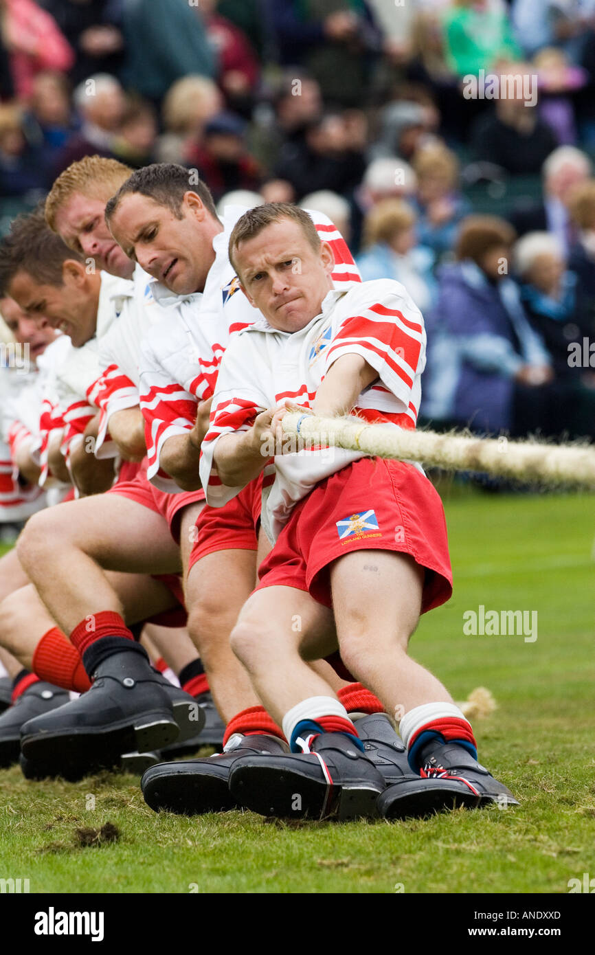 Men compete in Tug Of War contest at the Braemar Games Highland Gathering Scotland UK Stock Photo
