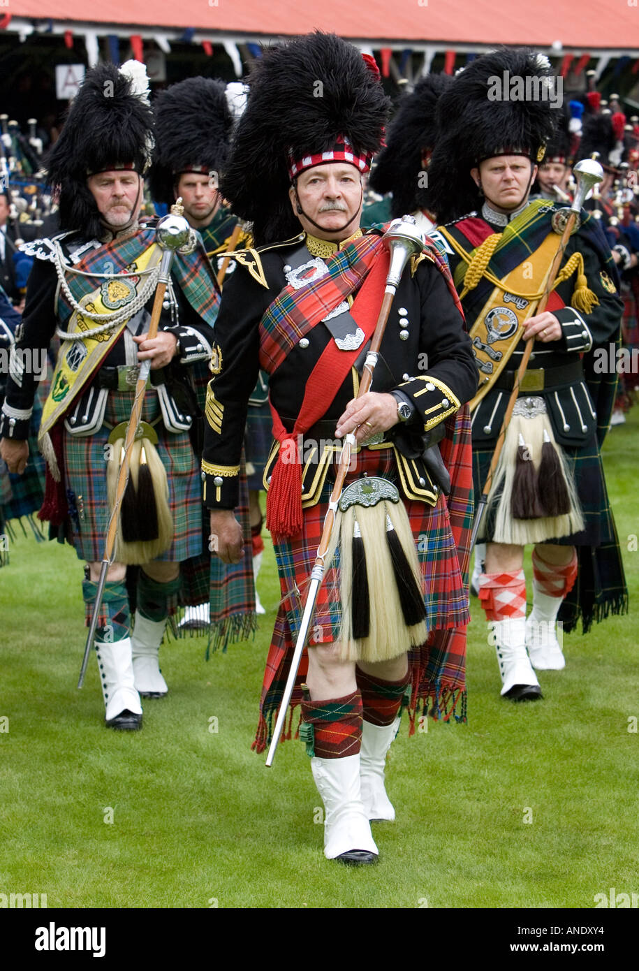 Drum Major leads band of Scottish pipers at Braemar Games Highland Gathering Scotland Stock Photo