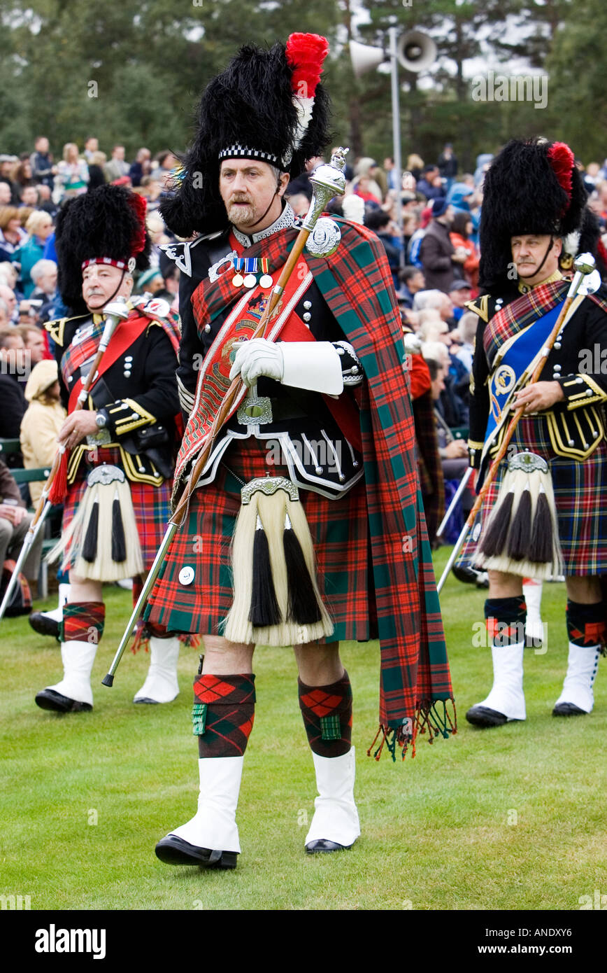 Drum Major leads massed band of Scottish pipers at Braemar Games Highland Gathering Scotland Stock Photo