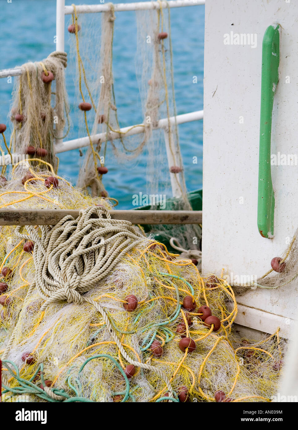 fishing nets on small boat and sea Stock Photo - Alamy