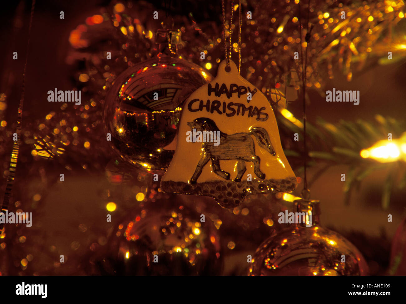 A Christmas tree decoration of a pottery bell with a pony Stock Photo