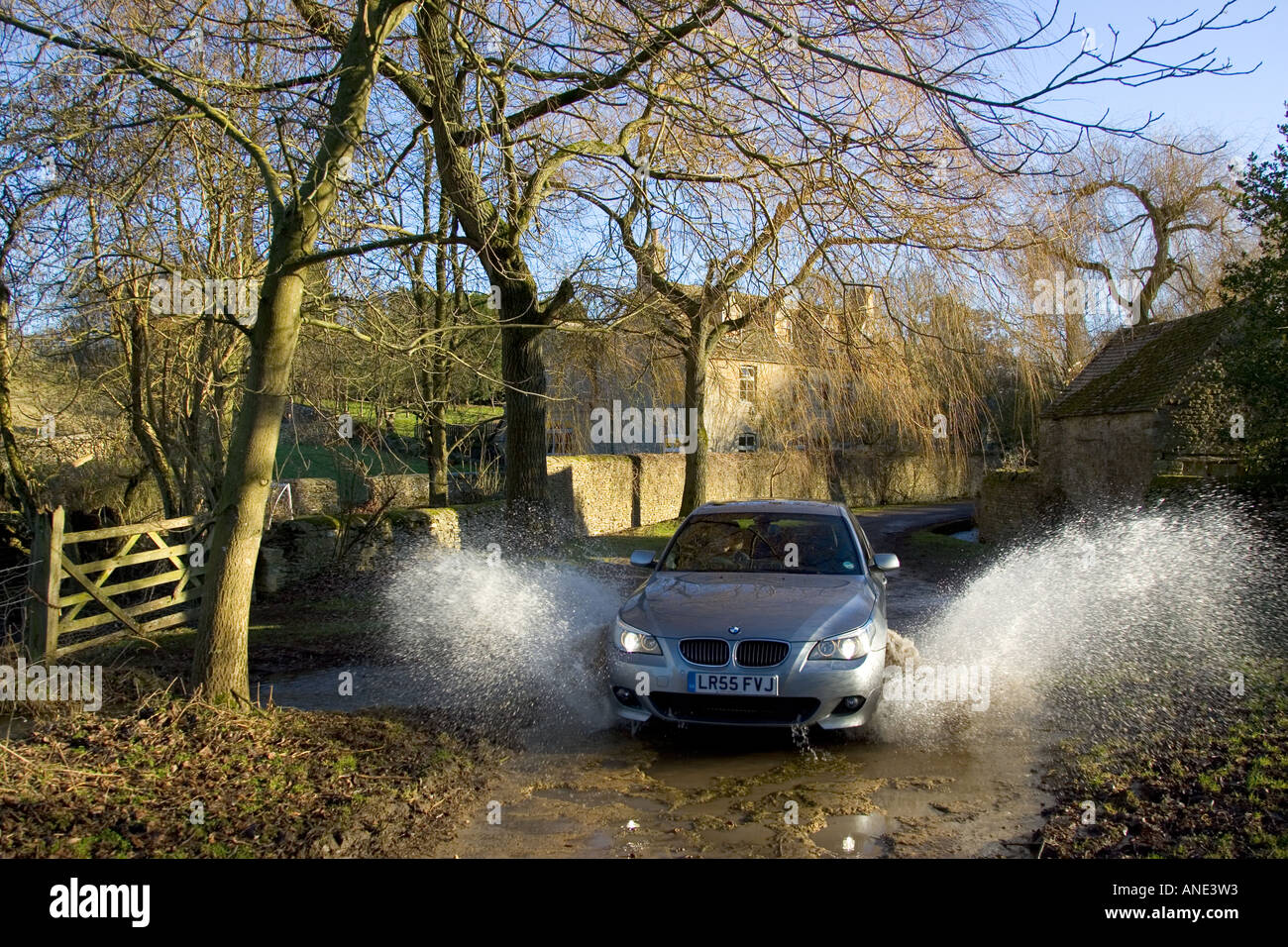 Car splashing through puddle in hi-res stock photography and images - Alamy