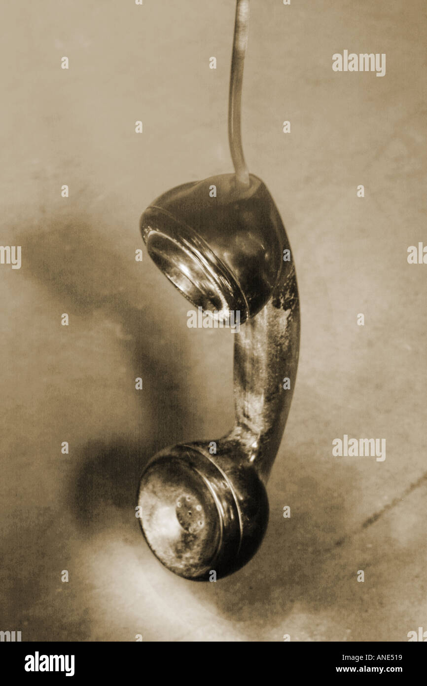 old telephone receiver hanging off the hook Stock Photo Alamy