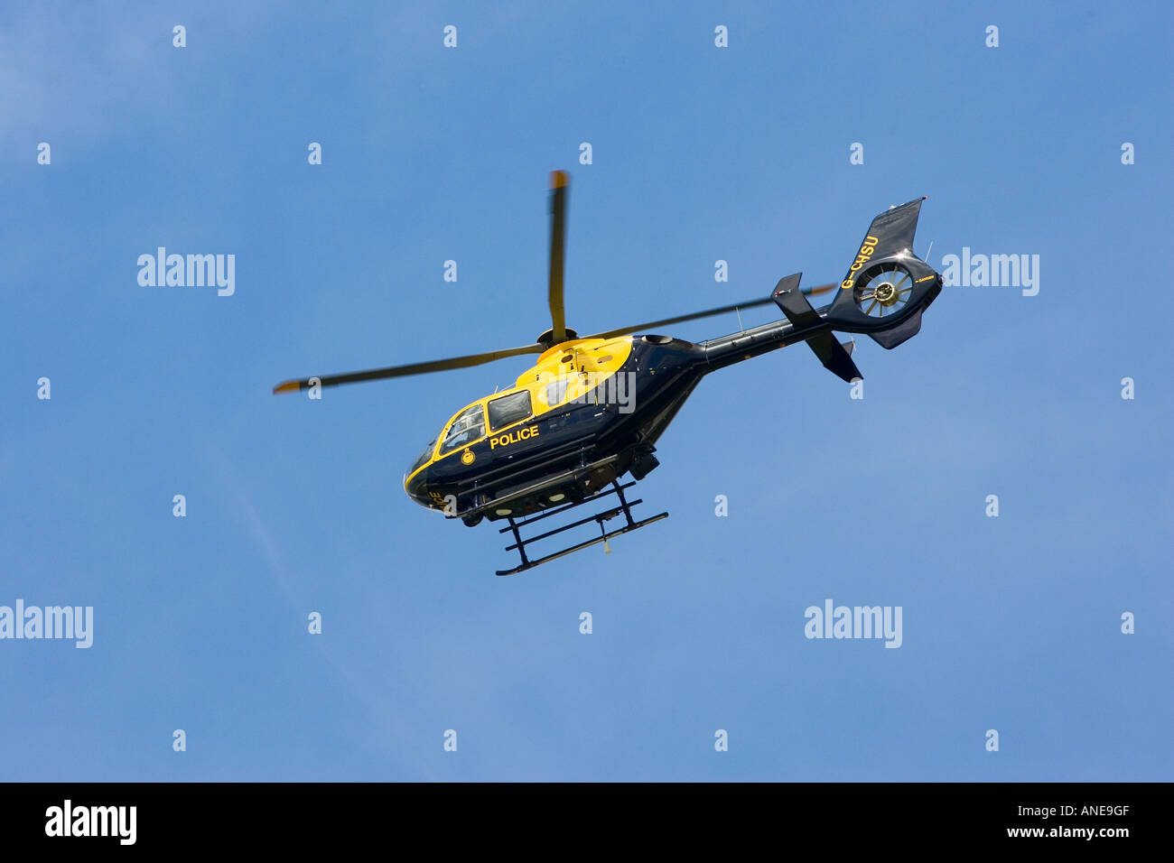 Police helicopter in flight over Gloucestershire United Kingdom Stock Photo