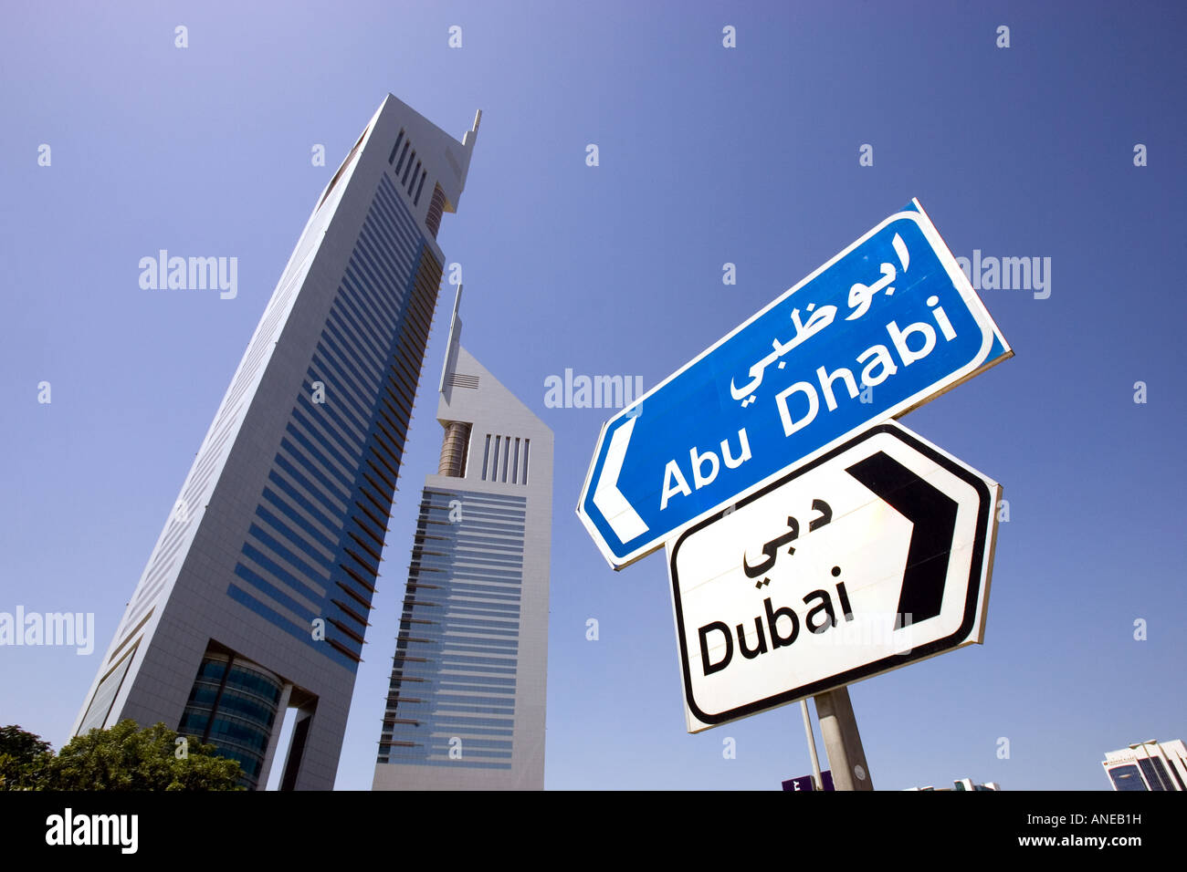 Street sign in front of Emirates Towers on Sheikh Zayed Road in Dubai, United Arab Emirates. Stock Photo