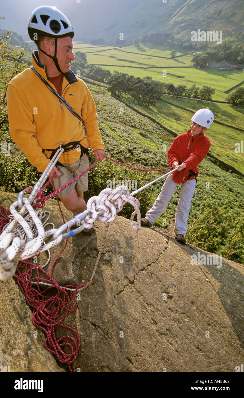 child rappelling with instructor Stock Photo - Alamy