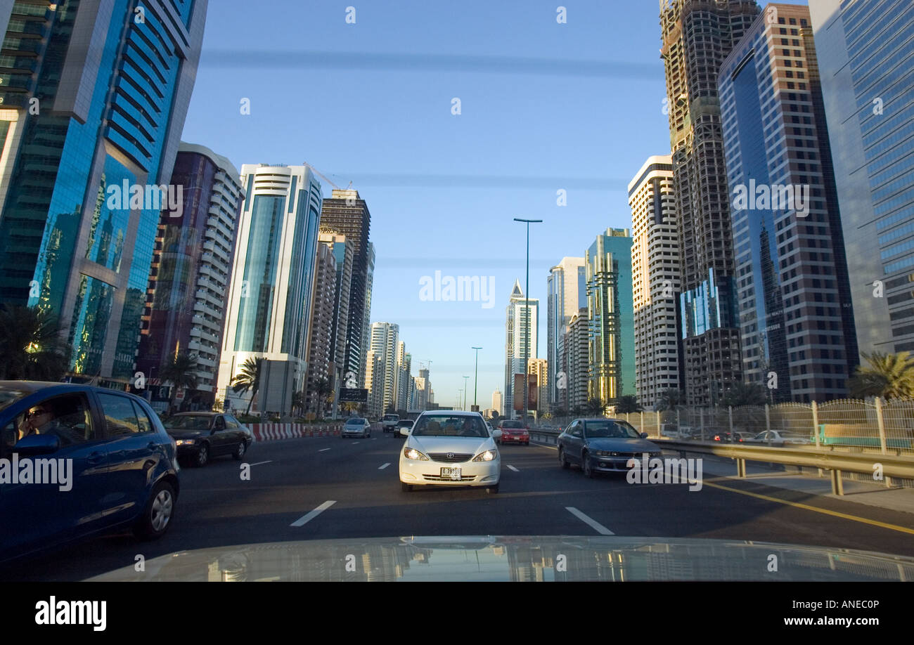 View from the back of a taxi as it drives down Sheikh Zayed Road in Dubai, UAE. Stock Photo