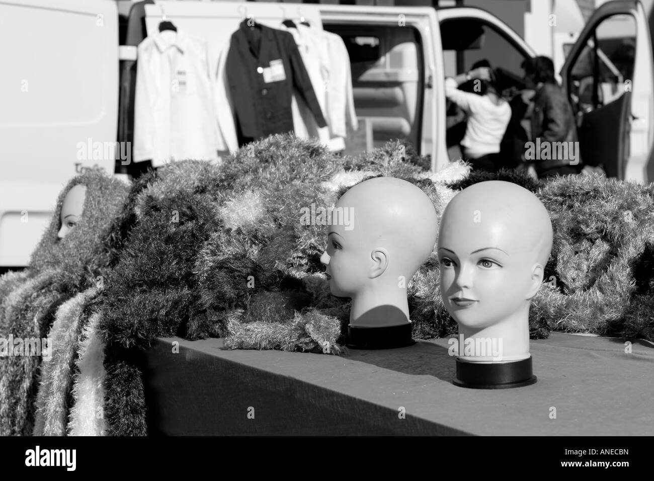 Two bald mannequin heads on sale at a French street market Stock Photo Alamy