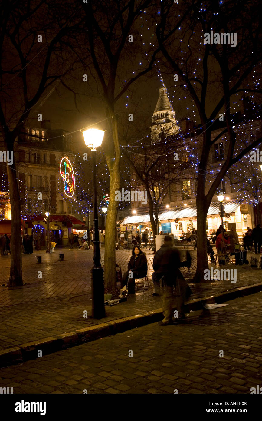 Night in the Place du Tertre and Sacre Coeur Chruch in Montmartre Paris France Stock Photo