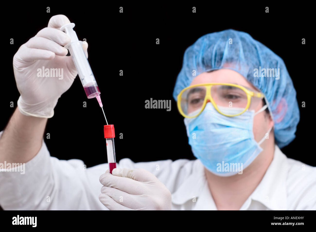 Medical worker examining a blood samples Stock Photo Alamy