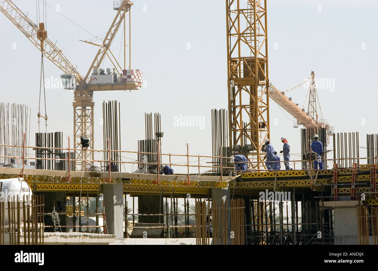 Indian construction workers on construction site in Dubai, UAE. Stock Photo