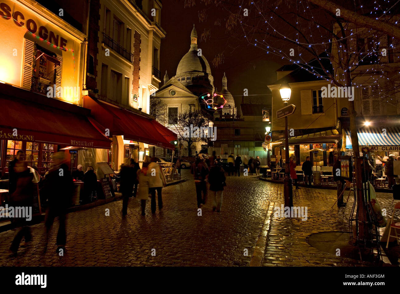 Night in the Place du Tertre and Sacre Coeur Chruch in Montmartre Paris France Stock Photo