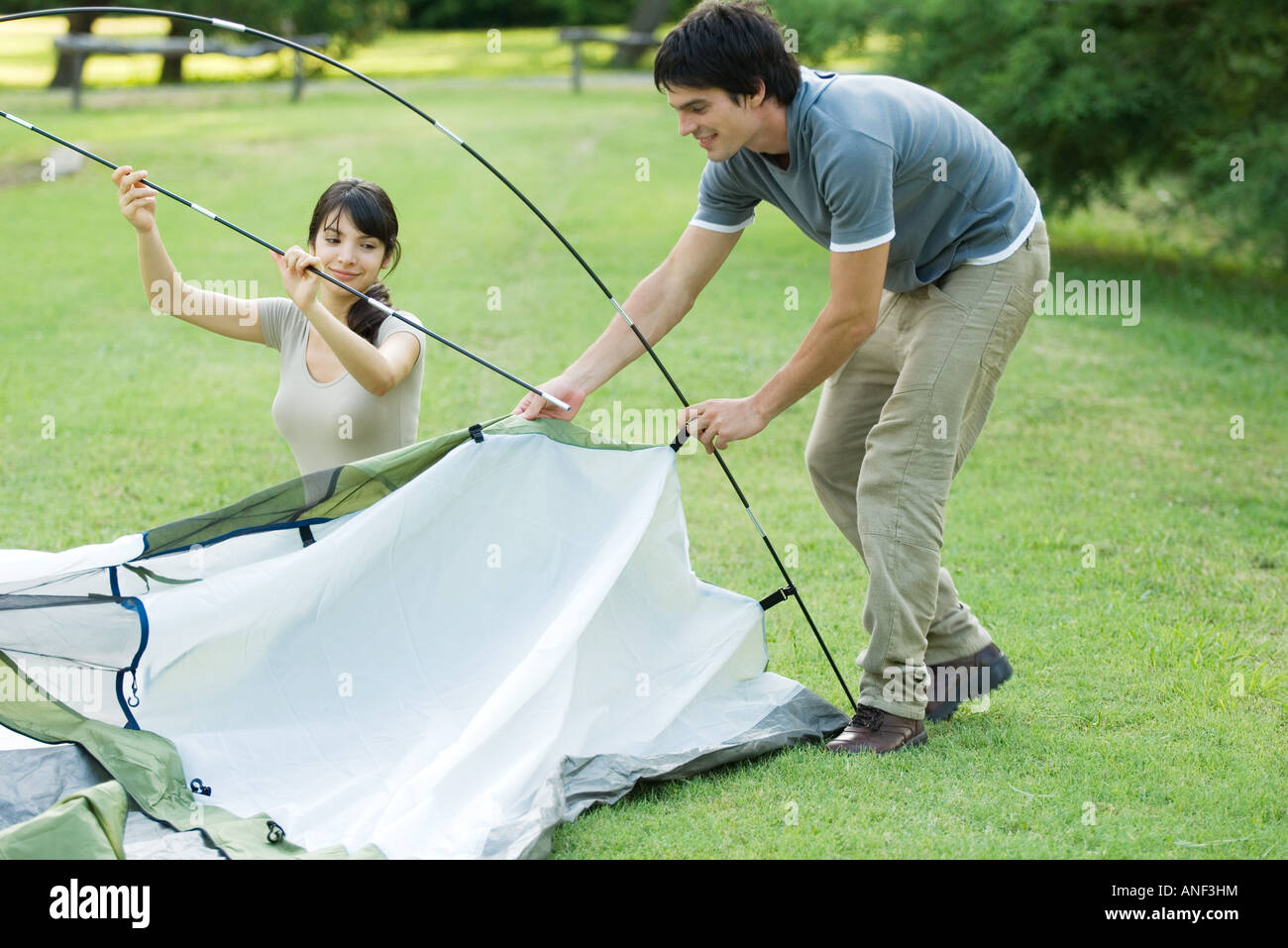 Young campers setting up tent Stock Photo