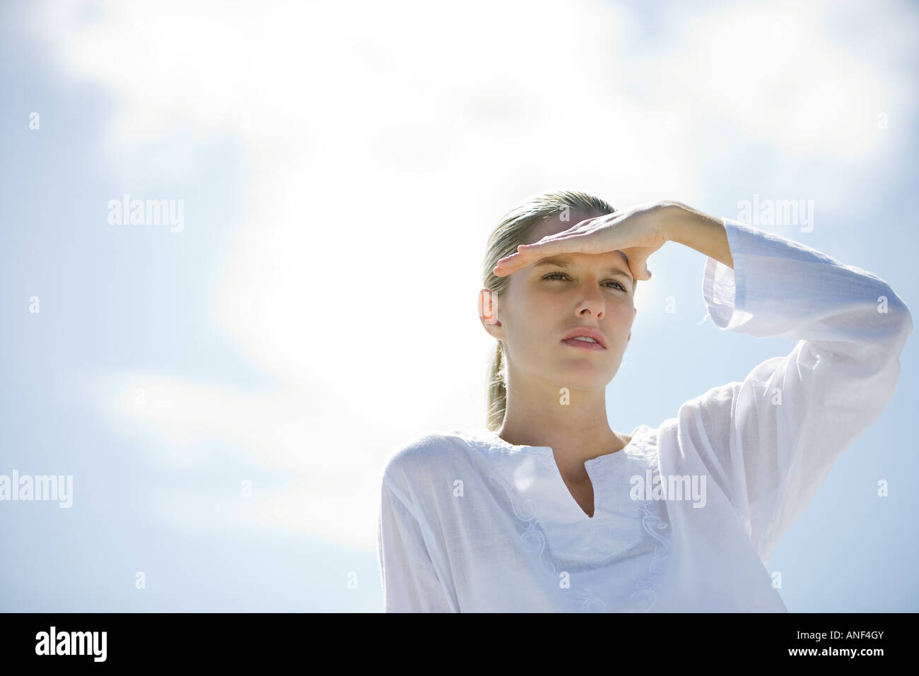 Shading eyes from the sun hires stock photography and images Alamy