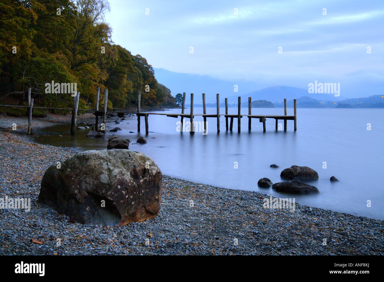 'Derwent Water' boulder lake shore and 'landing stage' at Brandlehow Bay. Lake District. Stock Photo