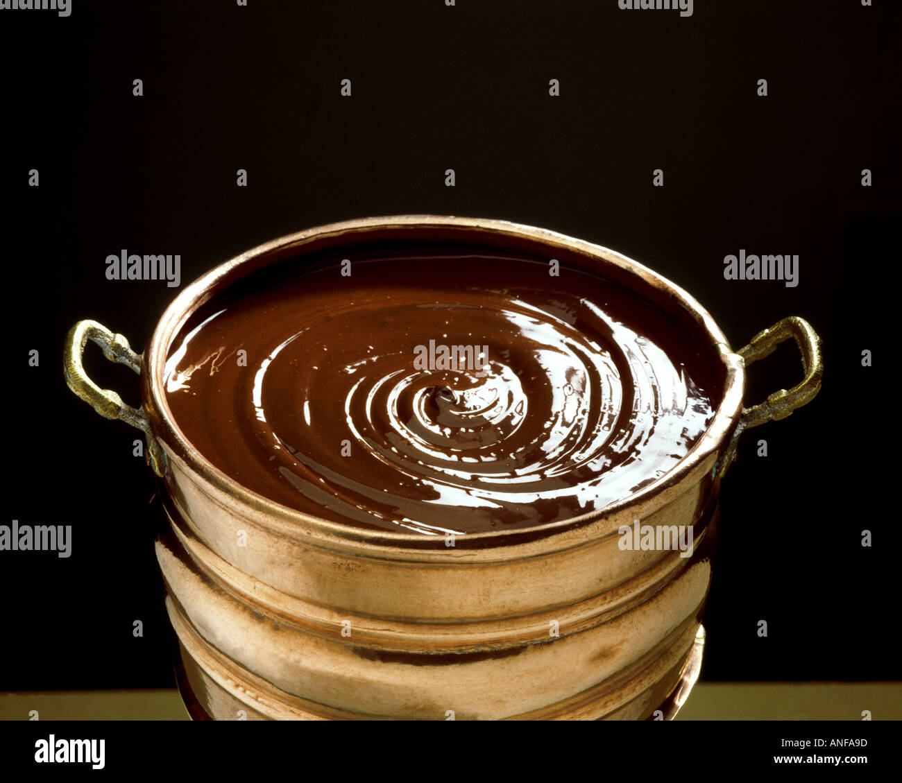 Melted chocolate in bright copper pot Stock Photo Alamy