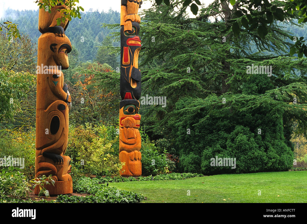 Totem poles, Butchart Gardens, Victoria, Vancouver Island, British Columbia, canada Stock Photo