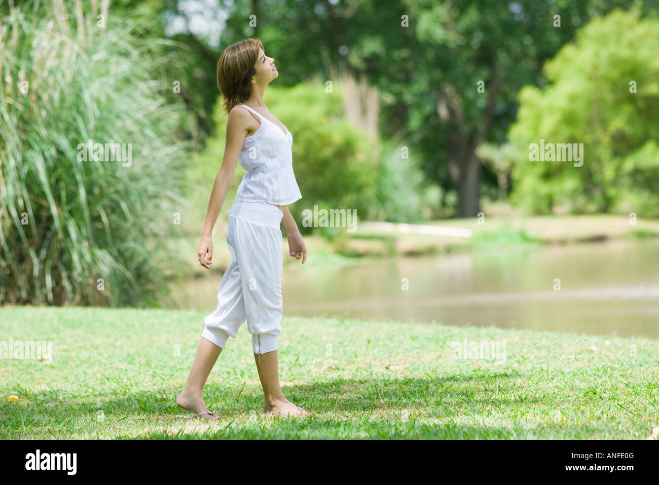 Woman walking barefoot on lake hi-res stock photography and images - Alamy