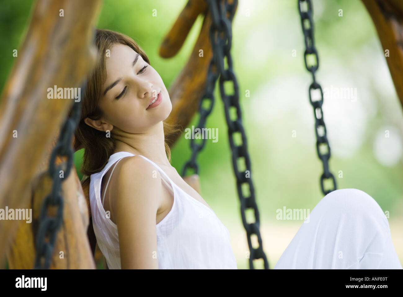 Teen girl sitting knees up hi-res stock photography and images - Alamy