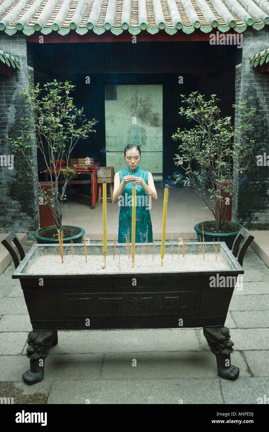 Young woman holding incense sticks hi-res stock photography and images ...