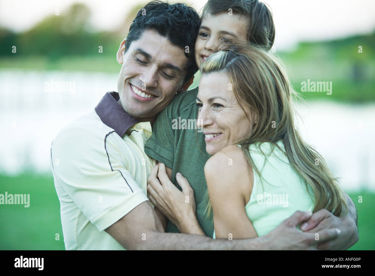 Family having group hug Stock Photo