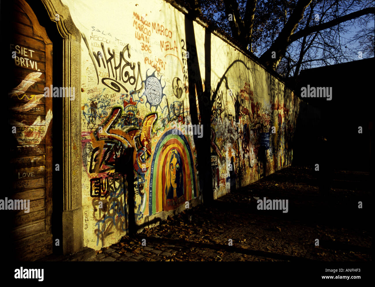 John Lennon Peace Wall, located in quiet square amidst Baroque