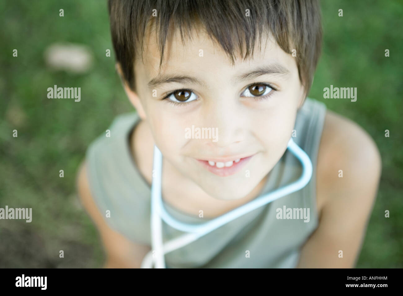 Little boy outdoors, wearing toy stethoscope around neck, high angle view Stock Photo