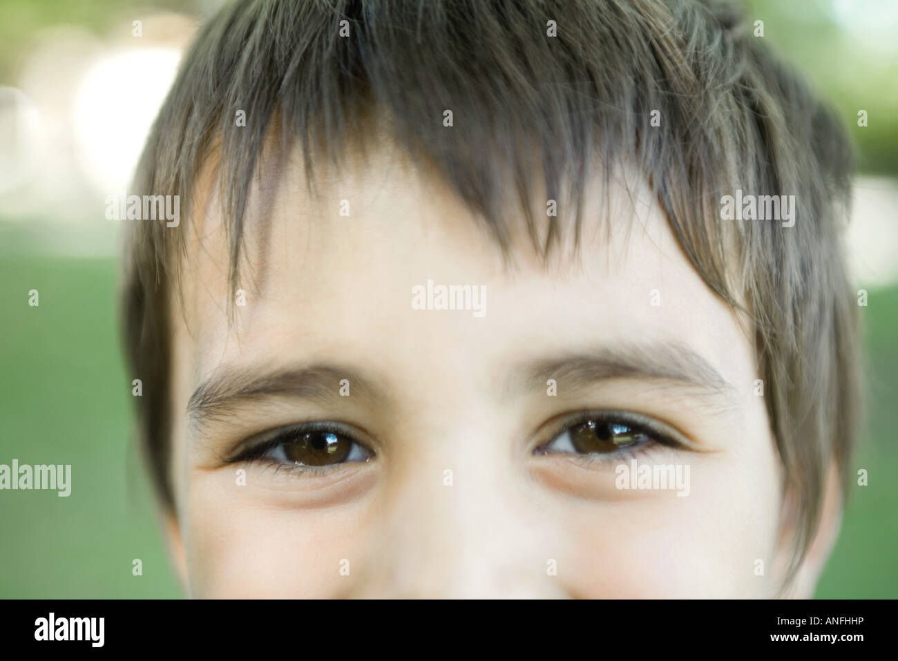 Little boy smiling at camera, cropped view of face, close-up Stock Photo