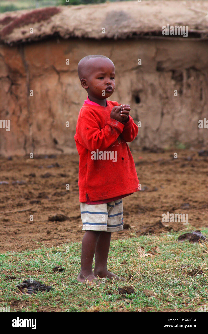 Maasai boy child in traditional village Masai Mara Kenya East Africa Stock Photo