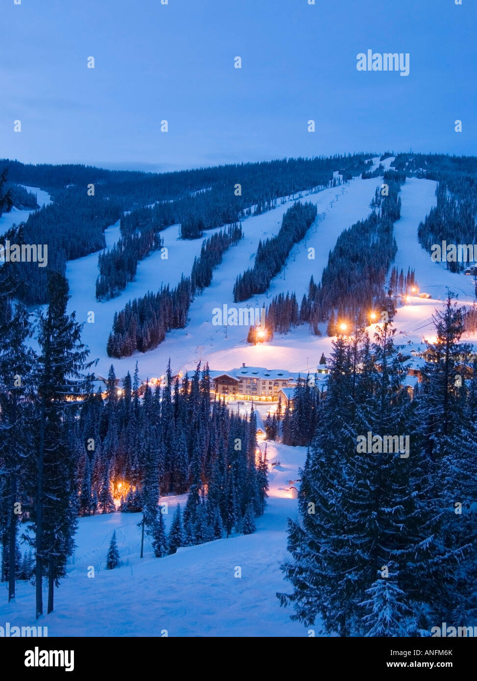 The Village at Sun Peaks Ski Resort glows in evening lights on the