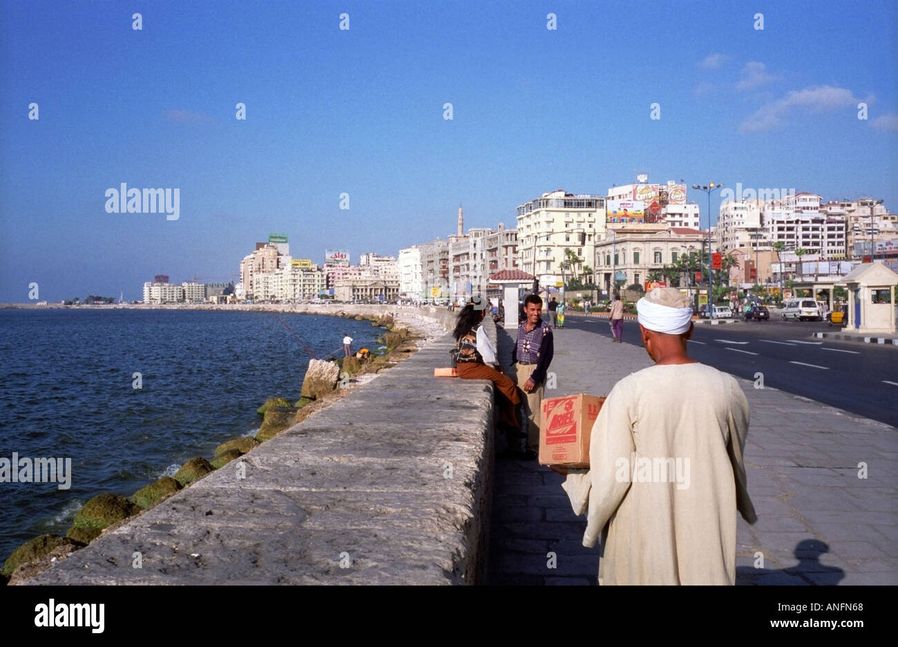 Locals walking along the Corniche of Alexandria, Egypt Stock Photo