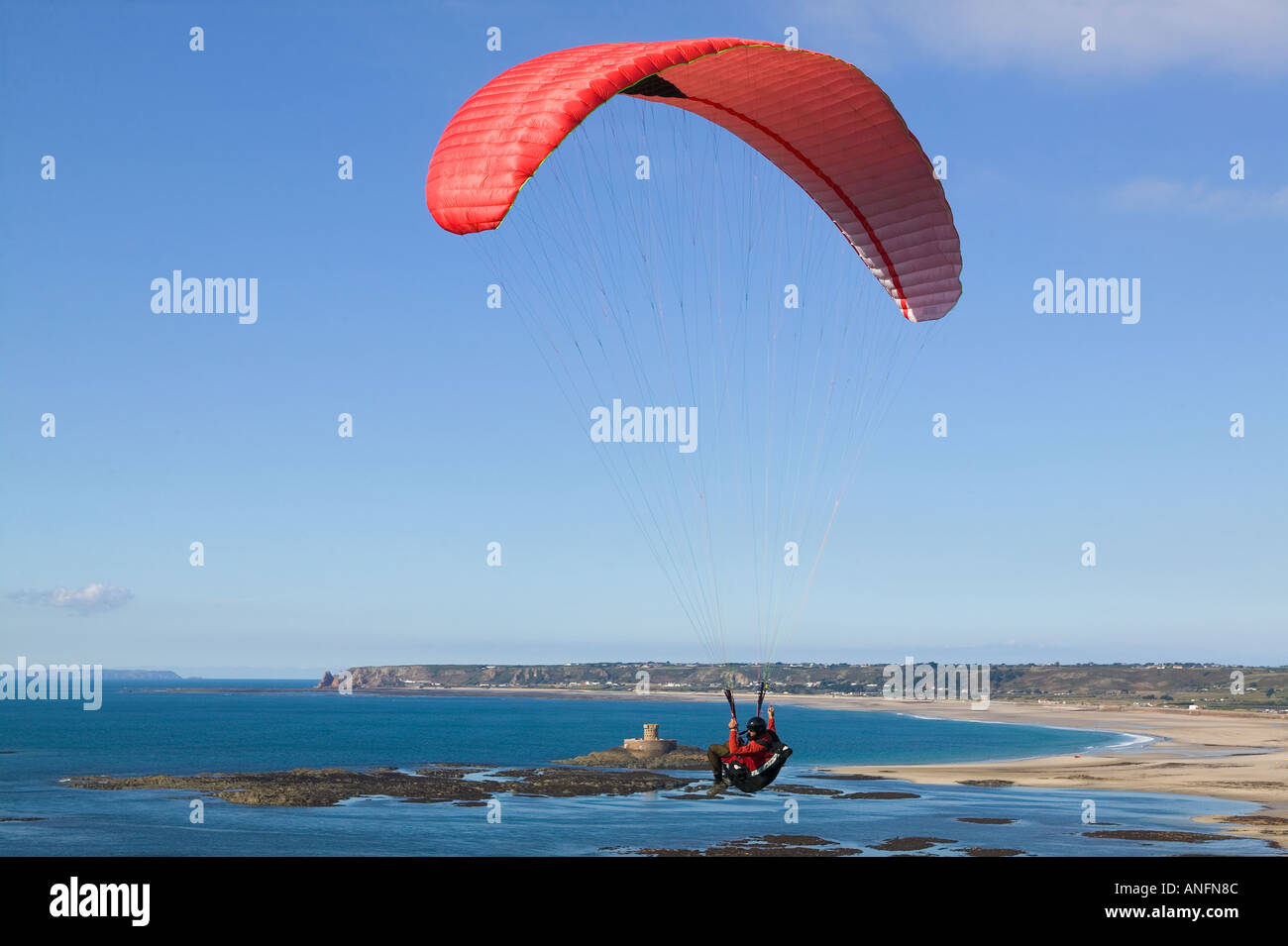 Paragliding over St Ouens beach, Jersey, Channel Islands Stock Photo - Alamy