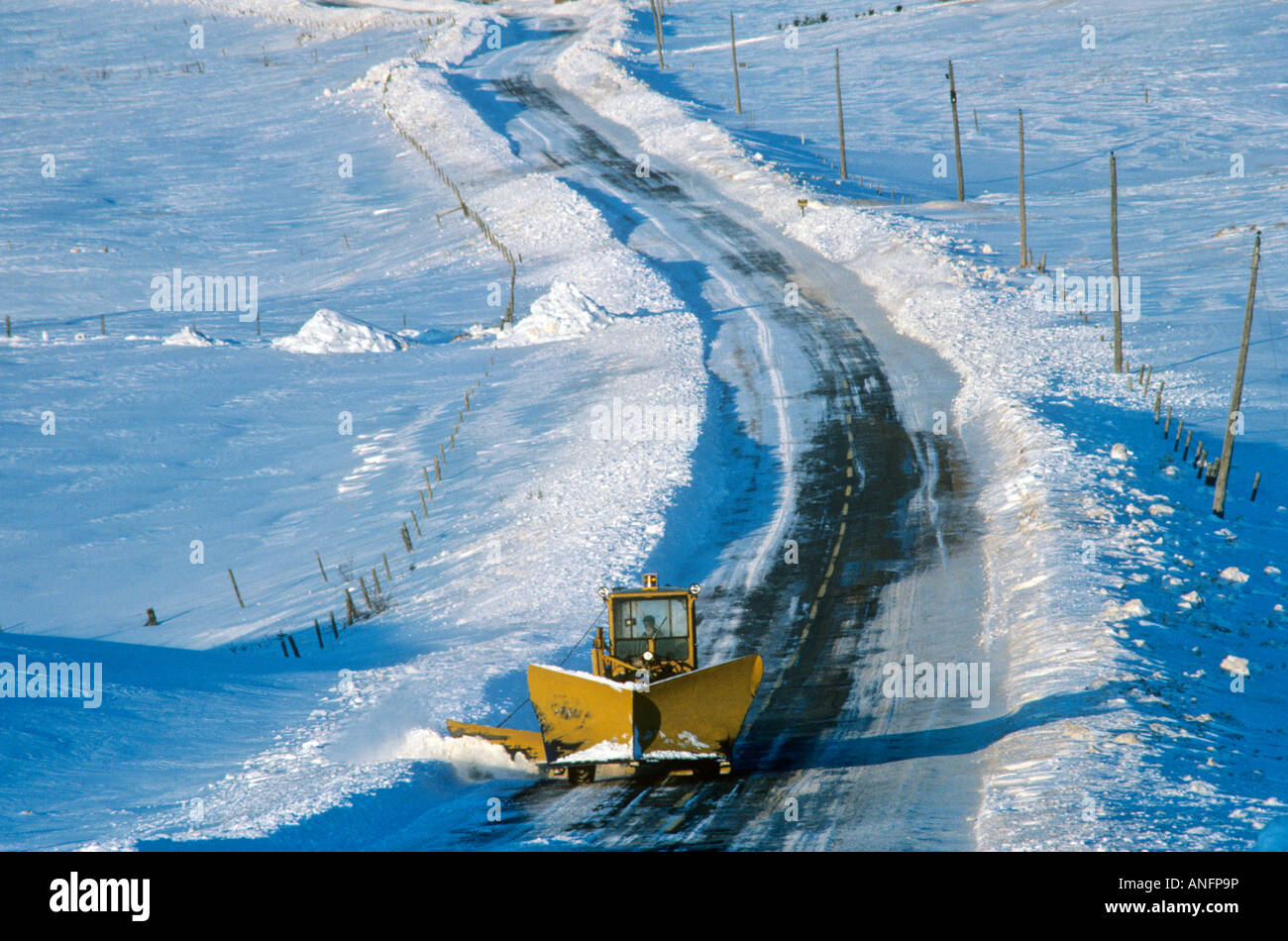 Snow plough on winter road, Park Corner, Prince Edward Island, Canada