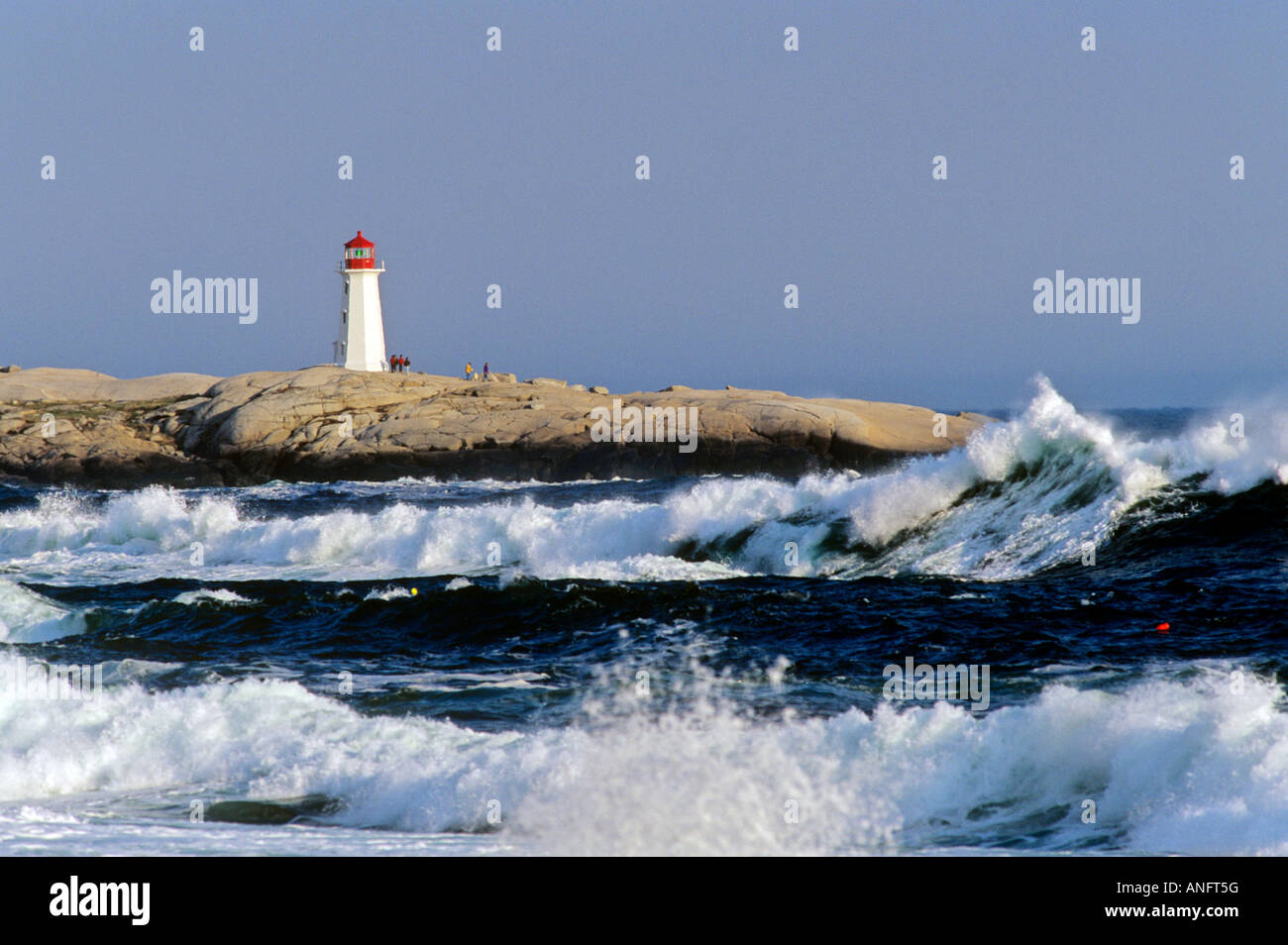 Waves breaking off Peggy's Cove Lighthouse, Nova Scotia, Canada Stock