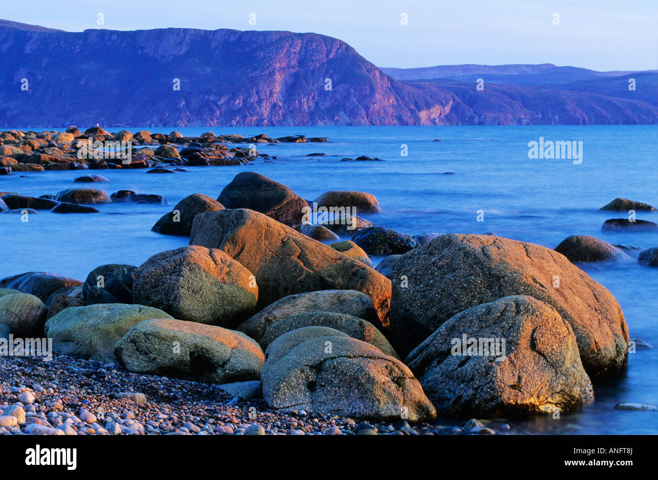 Rocks in evening light at Lobster Cove in Gros Morne National Park, Newfoundland, Canada Stock Photo